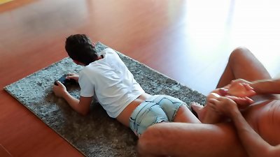 Gamer girl multitasks! toying NFS and make Footjob at the same time