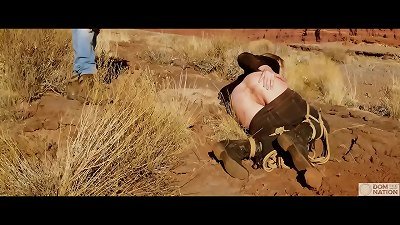 Big-ass ash-blonde gets her pooper whipped, then gets tough anal sex in mud and pee -- a real domination & submission session outdoors in the Western USA with Rebel Rhyder